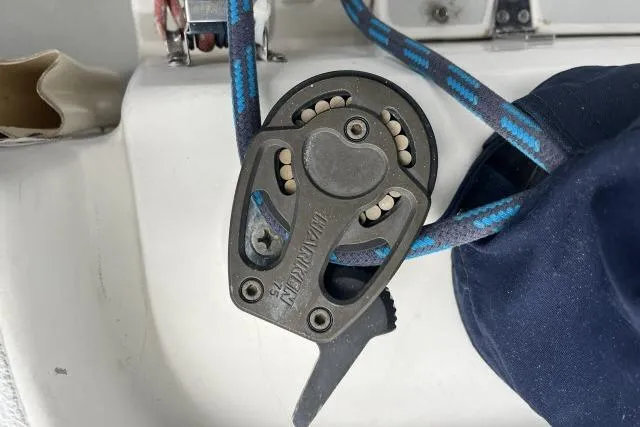 G Force Yacht Photos Pics Close-up of a 2004 J Boats J/133 sailboat pulley system with blue rope.