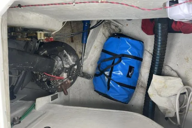 G Force Yacht Photos Pics Interior of 2004 J Boats J/133 sailboat with blue bag and mechanical components.