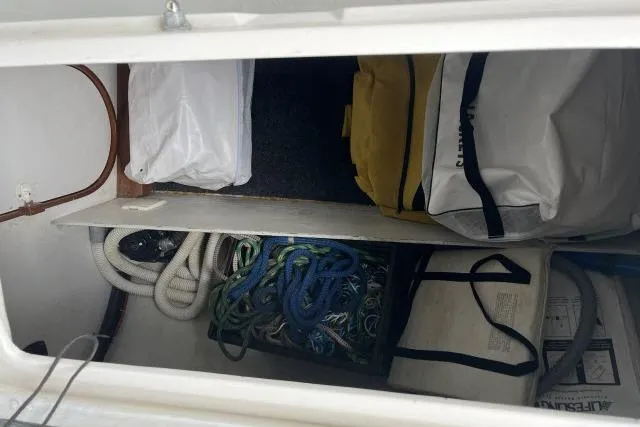 G Force Yacht Photos Pics Storage compartment of a 2004 J Boats J/133 with ropes and bags.