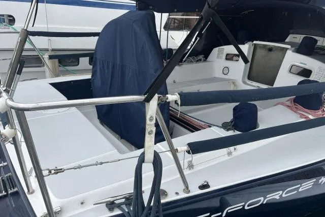 G Force Yacht Photos Pics 2004 J Boats J/133 sailboat cockpit with covered seating and nautical equipment.