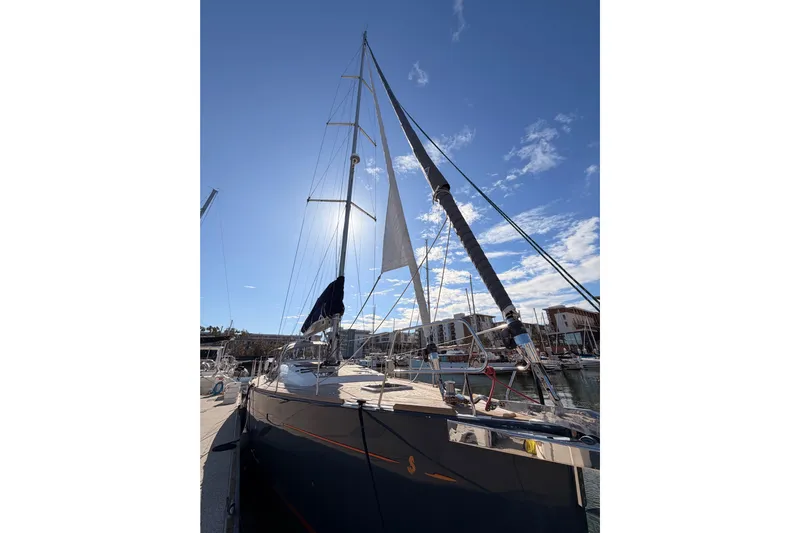 Gazelle II Yacht Photos Pics 2015 Beneteau Oceanis Yacht 60 docked under clear blue sky.