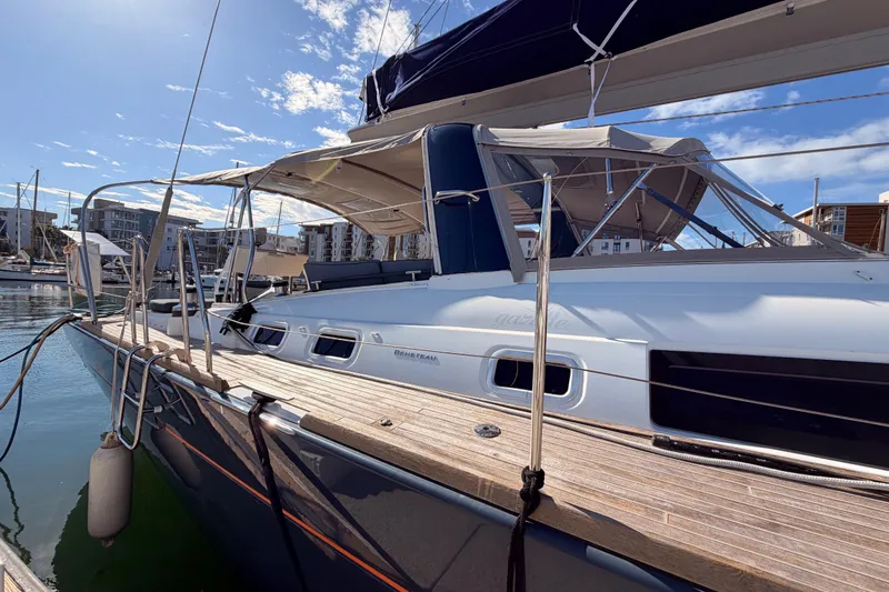 Gazelle II Yacht Photos Pics 2015 Beneteau Oceanis Yacht 60 docked in a sunny marina.