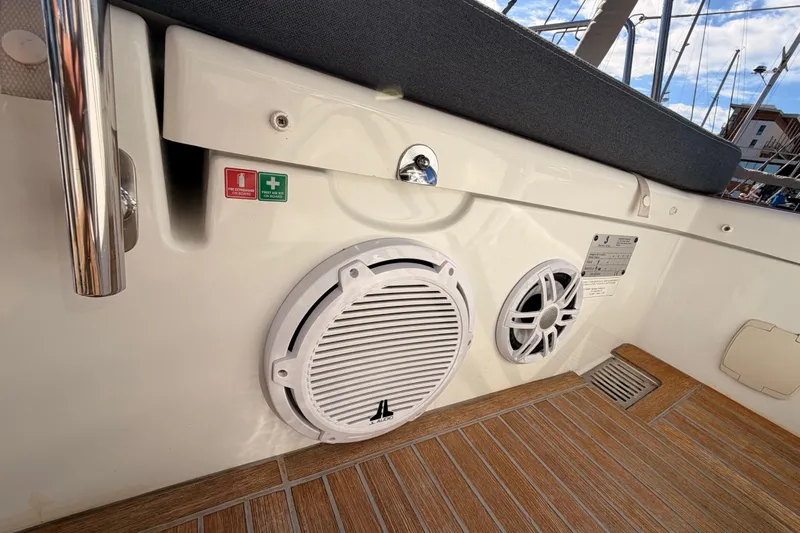 Gazelle II Yacht Photos Pics Beneteau Oceanis Yacht 60, 2015 model, deck view with speakers and safety signs.
