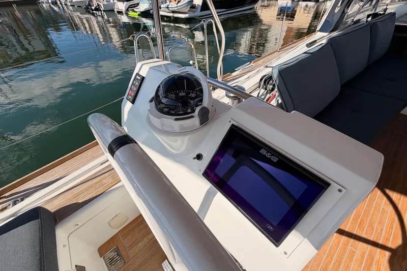 Gazelle II Yacht Photos Pics Beneteau Oceanis Yacht 60 cockpit with navigation instruments, docked in a marina, 2015 model.