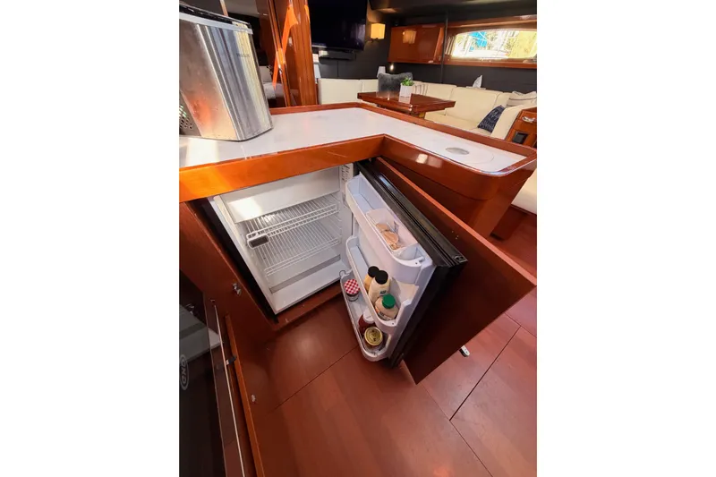 Gazelle II Yacht Photos Pics Interior of 2015 Beneteau Oceanis Yacht 60 with open fridge in modern kitchen.