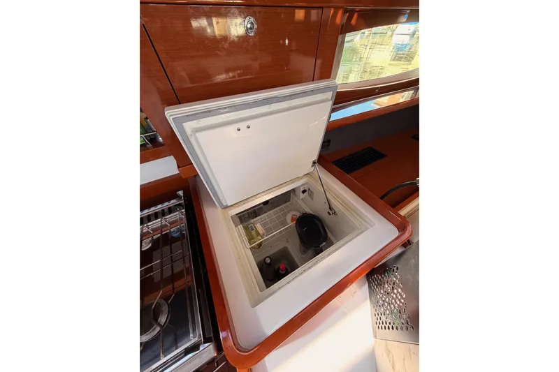 Gazelle II Yacht Photos Pics Beneteau Oceanis Yacht 60 (2015) interior with open storage compartment in the galley.