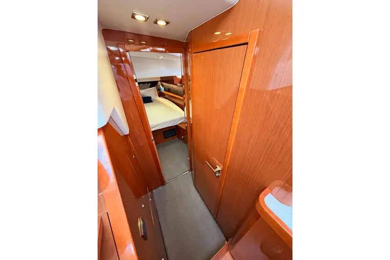 Gazelle II Yacht Photos Pics Luxurious interior of 2015 Beneteau Oceanis Yacht 60 with polished wood finish.