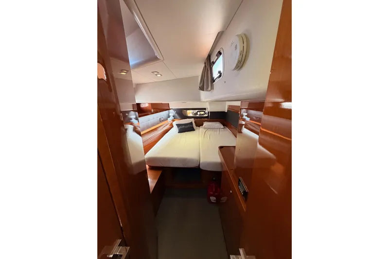 Gazelle II Yacht Photos Pics Luxurious cabin interior of 2015 Beneteau Oceanis Yacht 60 with elegant wood finish.