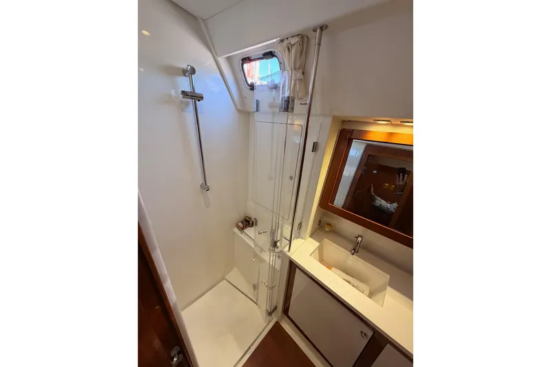 Gazelle II Yacht Photos Pics Luxurious bathroom in 2015 Beneteau Oceanis Yacht 60, featuring shower and sink.