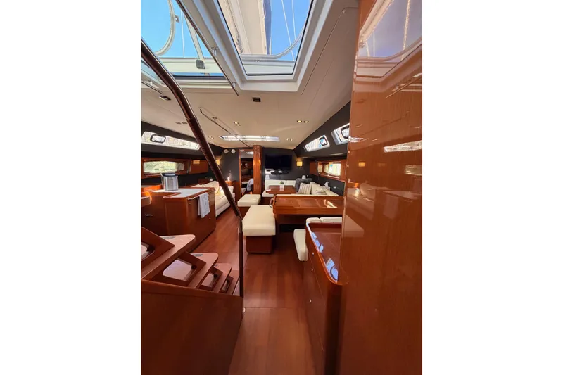 Gazelle II Yacht Photos Pics Luxurious interior of 2015 Beneteau Oceanis Yacht 60 with elegant wood finishes and spacious layout.