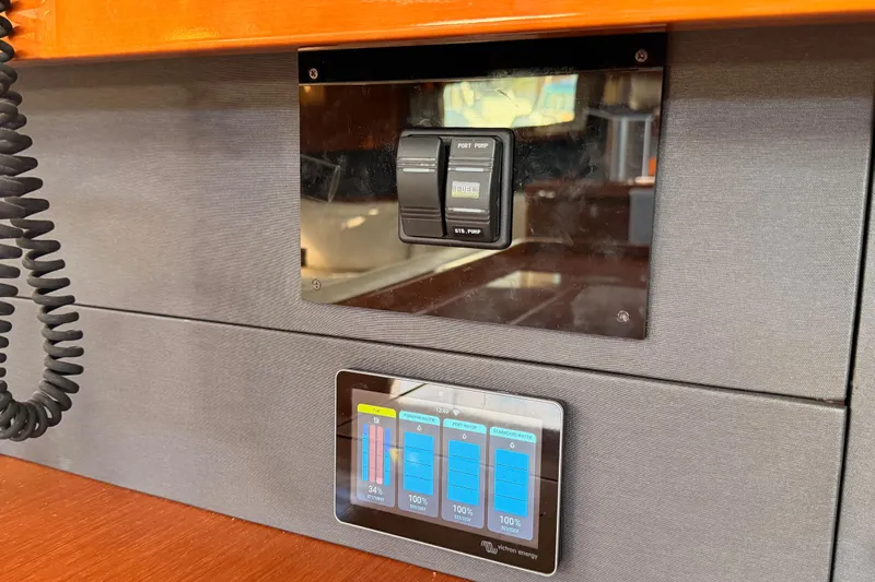 Gazelle II Yacht Photos Pics Control panel on a 2015 Beneteau Oceanis Yacht 60, featuring fuel and battery indicators.