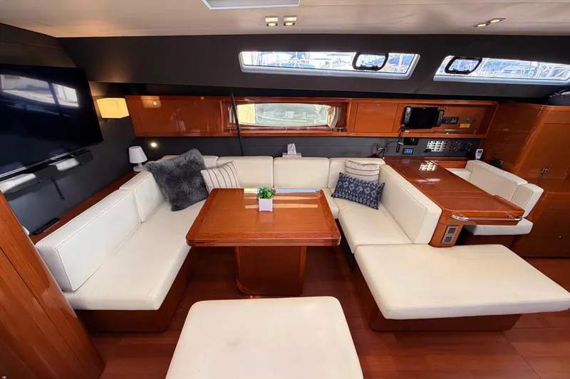 Gazelle II Yacht Photos Pics Luxurious interior of 2015 Beneteau Oceanis Yacht 60 with elegant seating and wooden finishes.