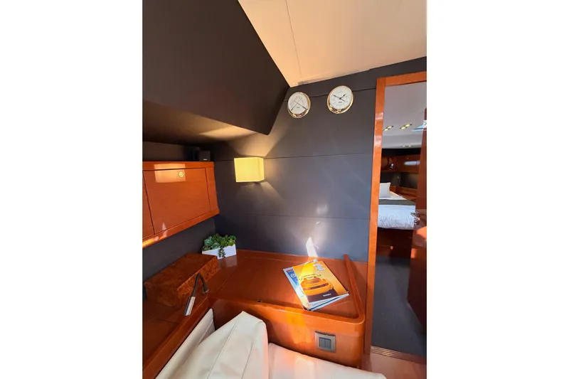 Gazelle II Yacht Photos Pics Luxurious interior of 2015 Beneteau Oceanis Yacht 60 with elegant wood finish and modern decor.