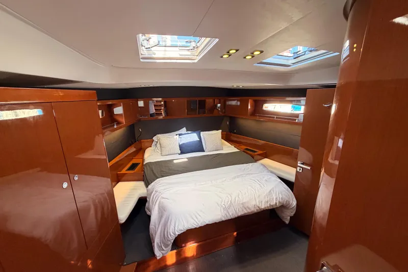 Gazelle II Yacht Photos Pics Luxurious cabin interior of 2015 Beneteau Oceanis Yacht 60 with elegant wood finish.