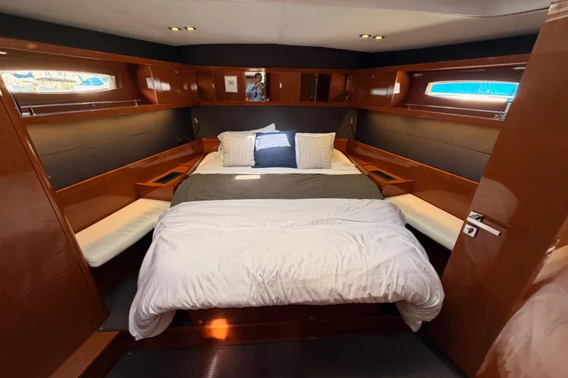 Gazelle II Yacht Photos Pics Luxurious cabin interior of 2015 Beneteau Oceanis Yacht 60 with cozy bedding.
