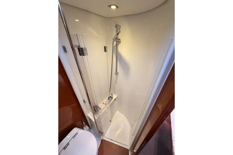 Gazelle II Yacht Photos Pics Compact shower area in 2015 Beneteau Oceanis Yacht 60, featuring modern fixtures and sleek design.