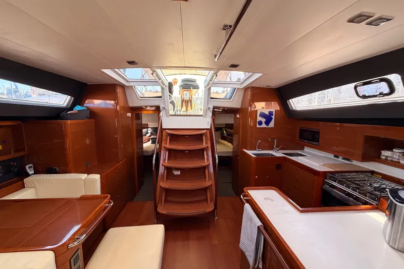 Gazelle II Yacht Photos Pics Luxurious interior of 2015 Beneteau Oceanis Yacht 60 with modern kitchen and seating area.