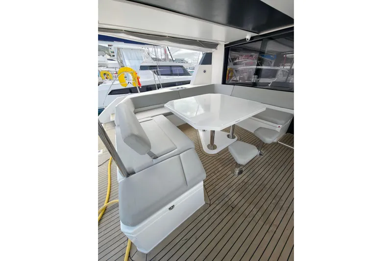 Old Marblehead Yacht Photos Pics Luxurious 2019 Leopard 50 yacht interior with sleek seating and modern dining area.