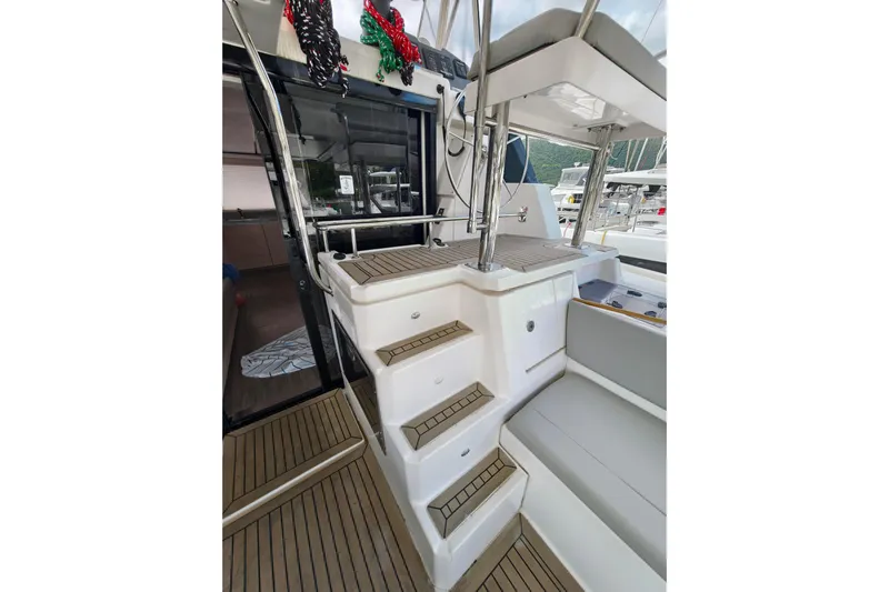 Old Marblehead Yacht Photos Pics 2019 Leopard 50 yacht interior with stairs and seating area.