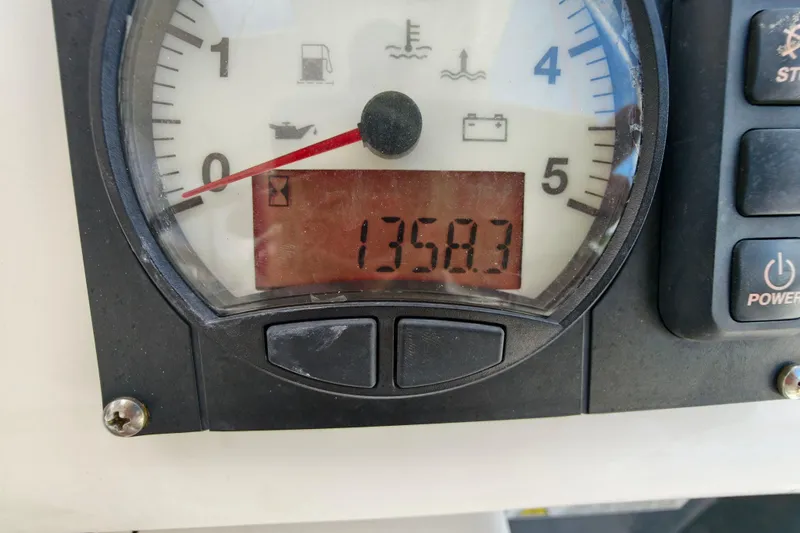 Old Marblehead Yacht Photos Pics Close-up of a Leopard 50 gauge panel displaying 1358.3 hours, 2019 model.
