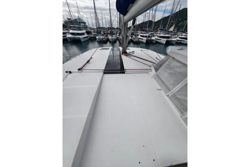 Old Marblehead Yacht Photos Pics 2019 Leopard 50 catamaran docked in a marina, surrounded by other boats.