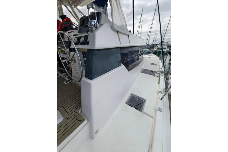 Old Marblehead Yacht Photos Pics 2019 Leopard 50 yacht deck with steering wheel and marina view.