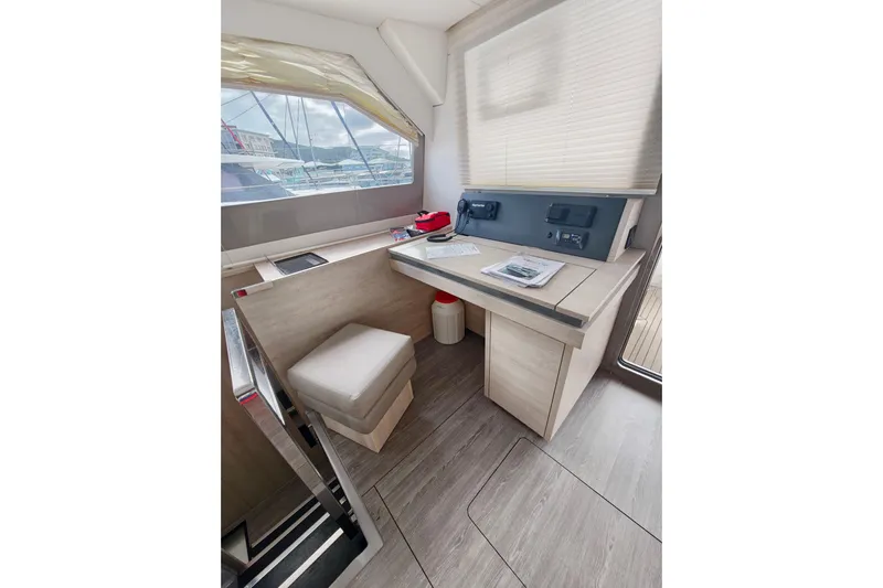 Old Marblehead Yacht Photos Pics Interior of 2019 Leopard 50 yacht with navigation station and seating area.