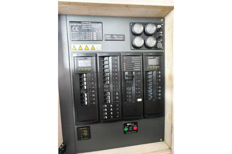 Old Marblehead Yacht Photos Pics Electrical panel of a 2019 Leopard 50, featuring circuit breakers and voltage indicators.