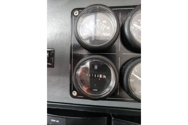 Old Marblehead Yacht Photos Pics Dashboard gauges of a 2019 Leopard 50, displaying engine hours and oil pressure.