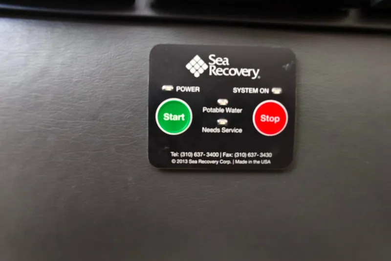 Old Marblehead Yacht Photos Pics Control panel of a Sea Recovery system with start and stop buttons.