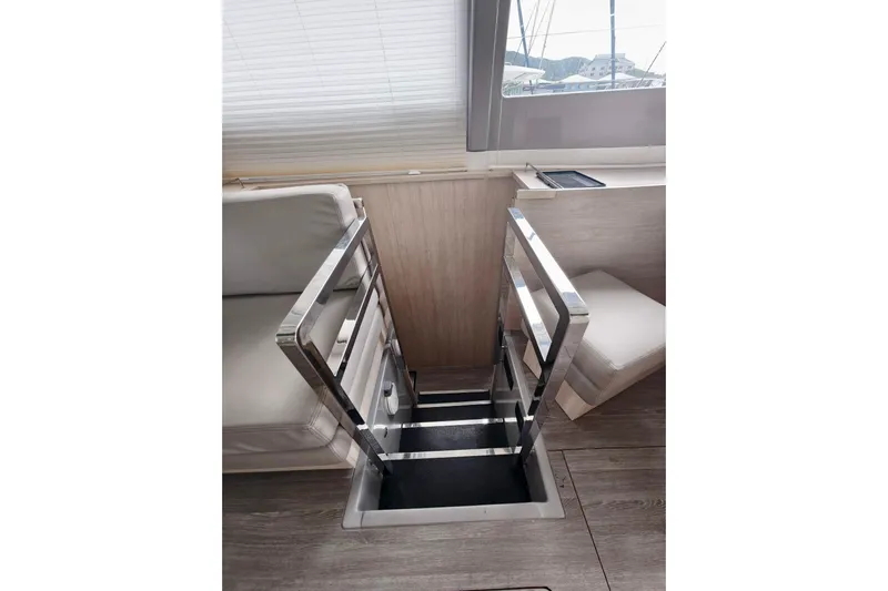 Old Marblehead Yacht Photos Pics Interior of 2019 Leopard 50 yacht with sleek metal staircase and modern design.