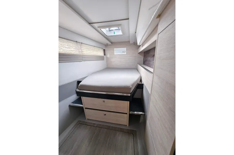 Old Marblehead Yacht Photos Pics Compact bedroom interior of 2019 Leopard 50 yacht with modern design and storage drawers.