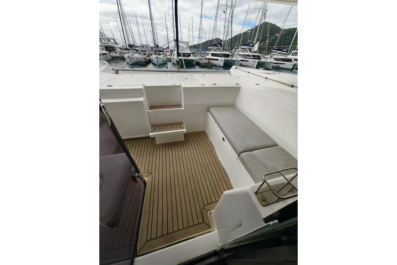 Old Marblehead Yacht Photos Pics 2019 Leopard 50 yacht deck with seating, docked at marina.