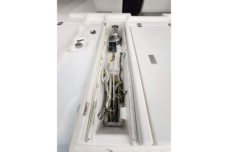 Old Marblehead Yacht Photos Pics Interior view of a 2019 Leopard 50 yacht's storage compartment with ropes and equipment.