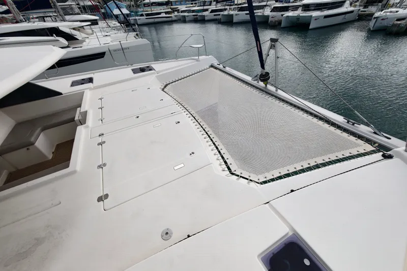 Old Marblehead Yacht Photos Pics 2019 Leopard 50 catamaran deck with netting, docked at marina.