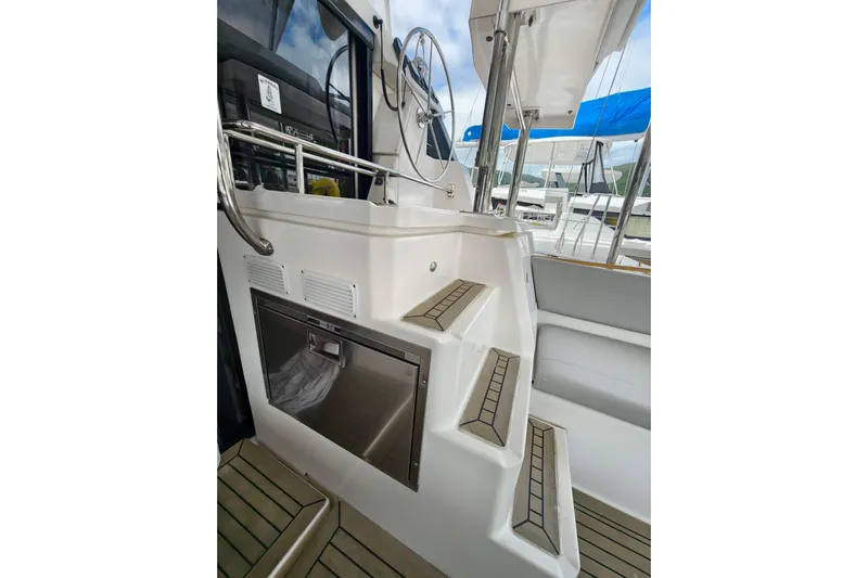 Old Marblehead Yacht Photos Pics 2019 Leopard 50 yacht interior with stairs and steering wheel.