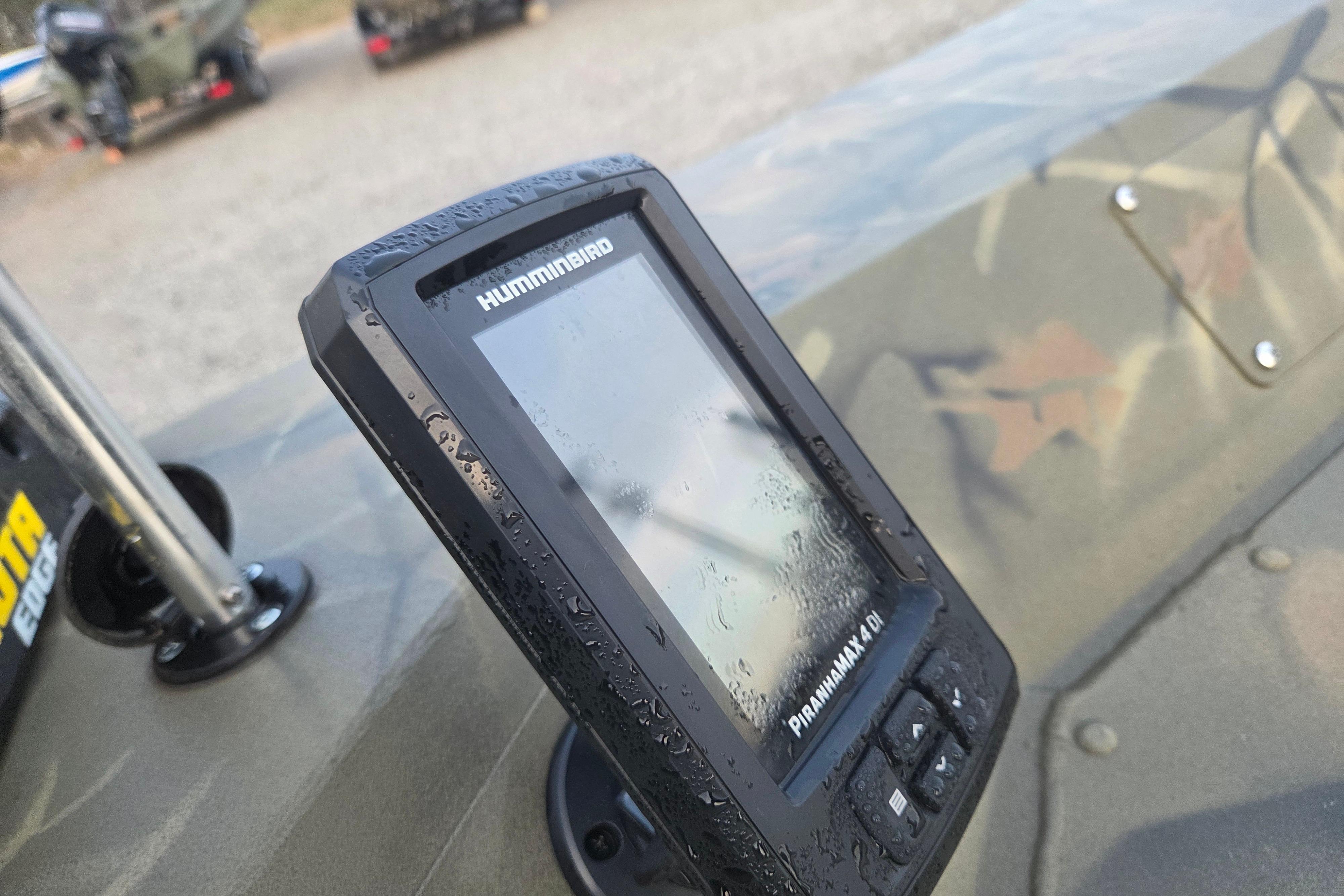 Humminbird fish finder on 2018 Tracker Grizzly 1860 CC boat, wet with water droplets.