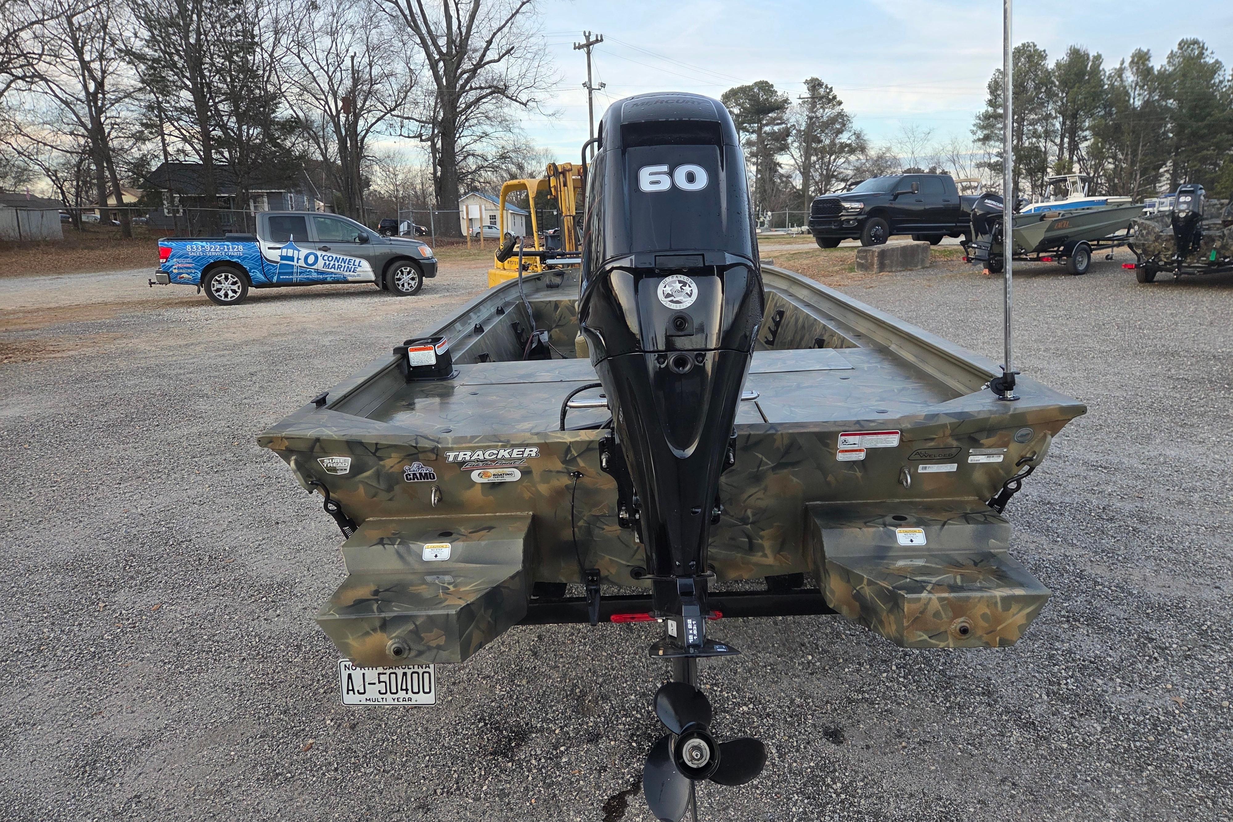 2018 Tracker Grizzly 1860 CC boat with camo design and 60 HP outboard motor.