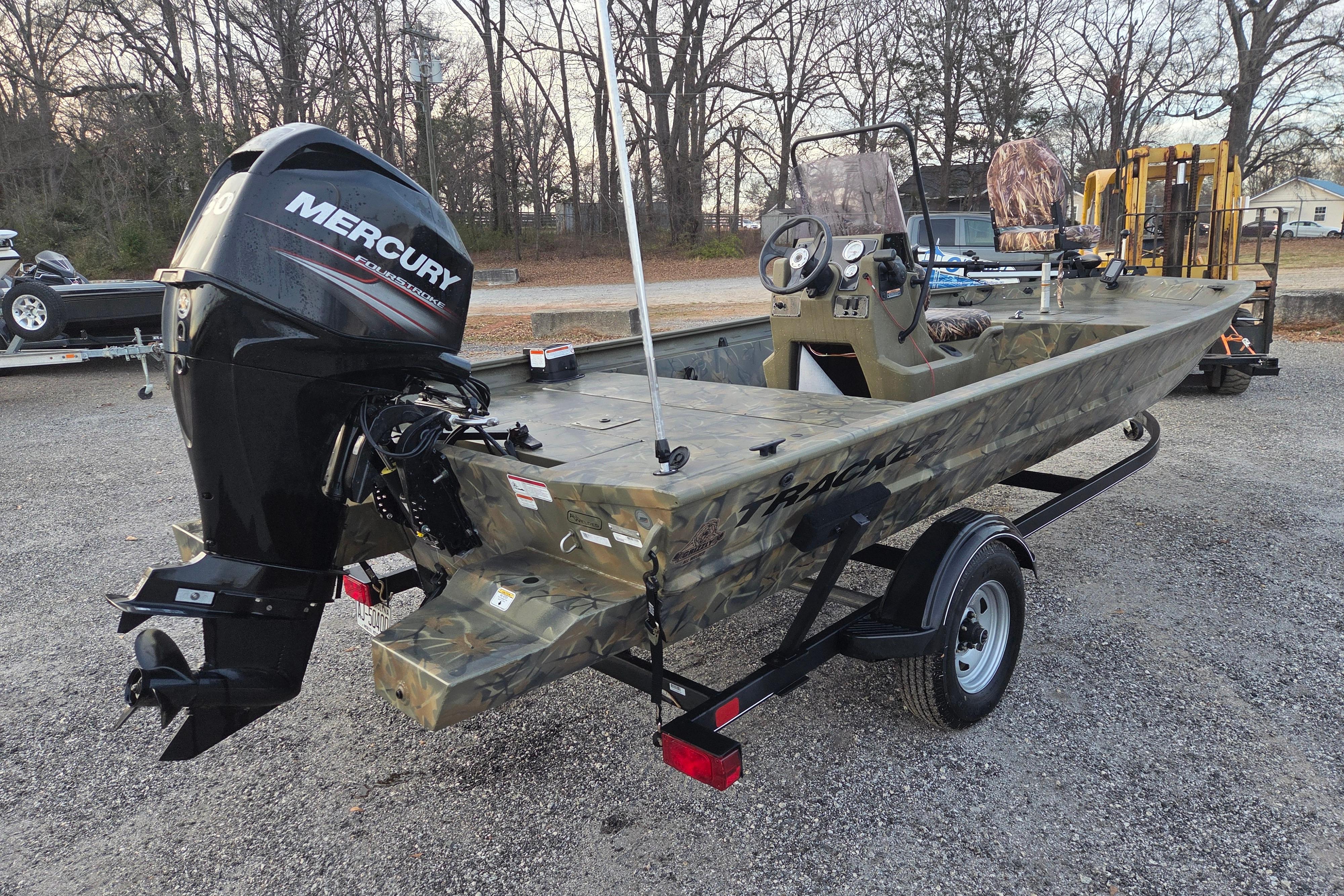 2018 Tracker Grizzly 1860 CC boat with Mercury outboard motor on trailer.