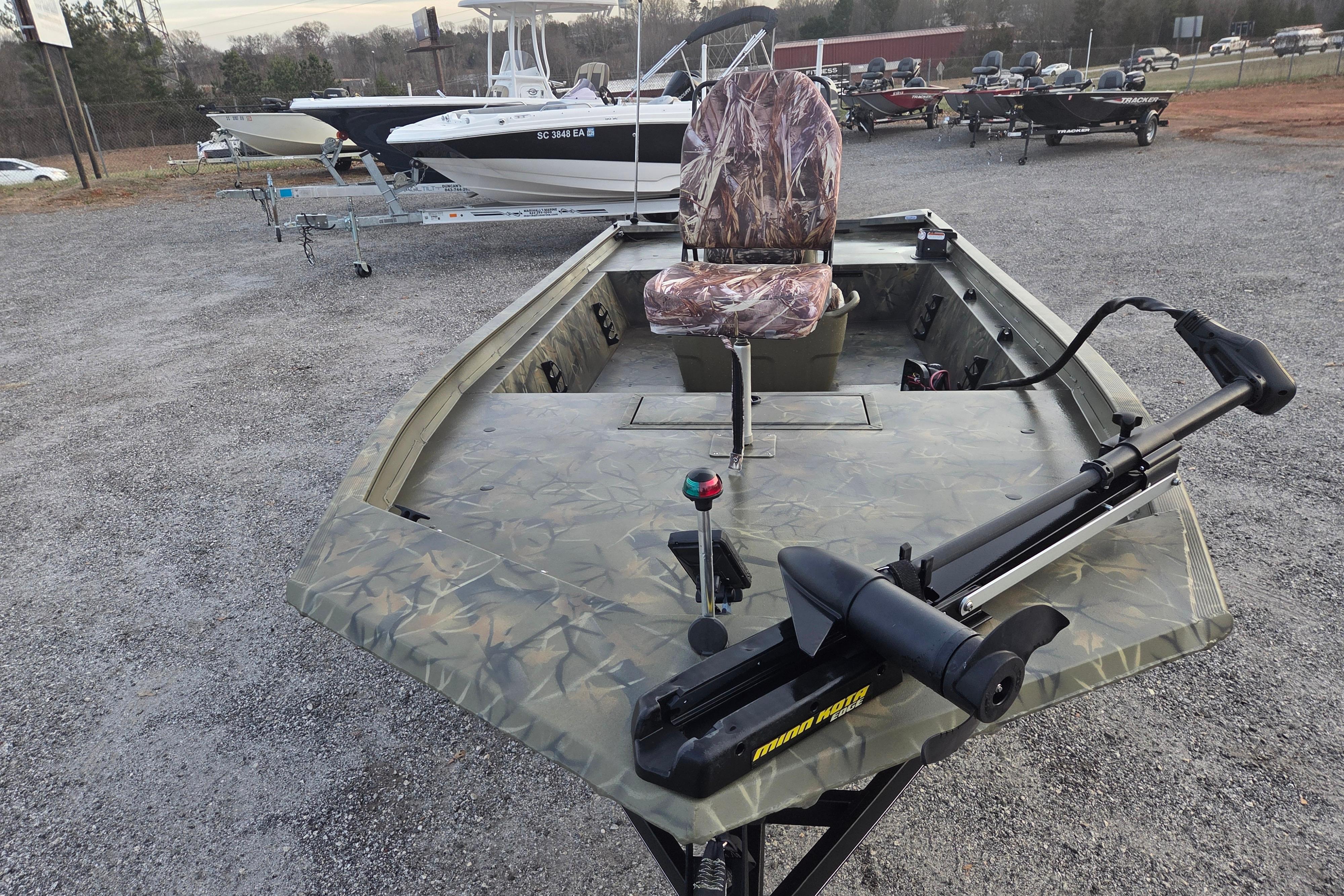 2018 Tracker Grizzly 1860 CC boat with camouflage design and trolling motor.
