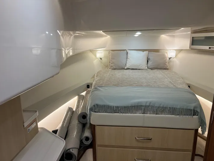  Yacht Photos Pics 2023 Regal 36 XO yacht interior cabin with bed and storage.
