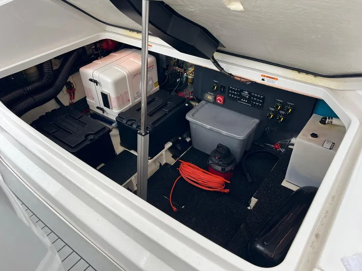  Yacht Photos Pics Engine compartment of 2023 Regal 36 XO boat, featuring equipment and storage.