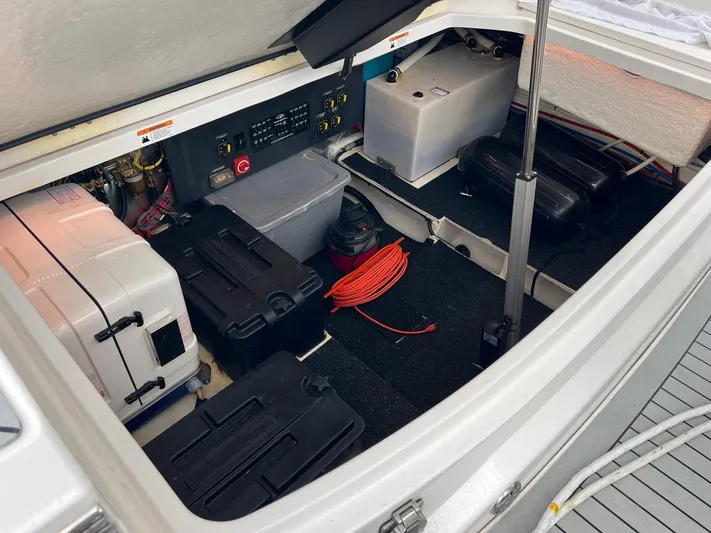  Yacht Photos Pics 2023 Regal 36 XO boat storage compartment with equipment and wiring.