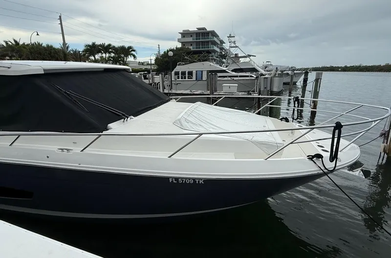  Yacht Photos Pics 2023 Regal 36 XO boat docked at marina, featuring sleek design and modern amenities.