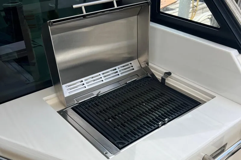  Yacht Photos Pics Built-in grill on 2023 Regal 36 XO boat, featuring stainless steel design.