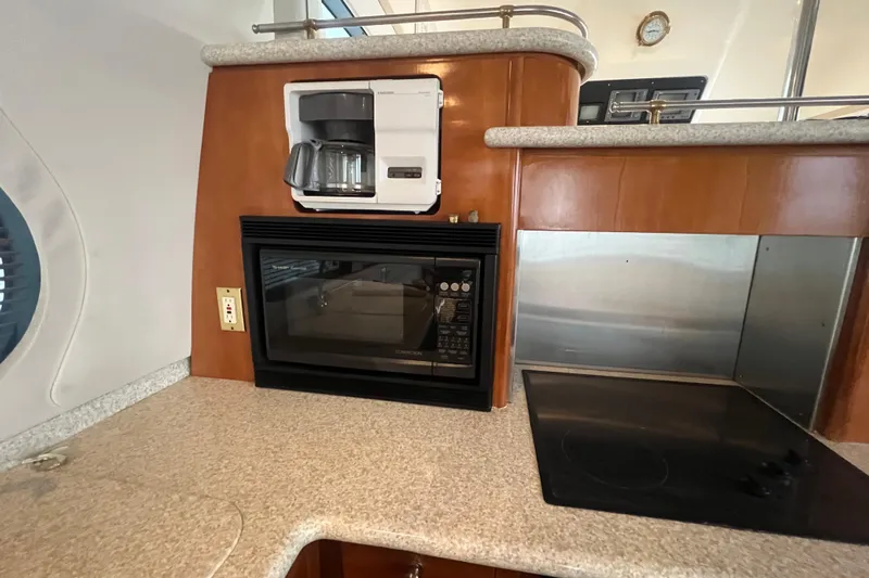 Betty Jean Yacht Photos Pics Kitchen area of 2000 Carver 530 Voyager Pilothouse with coffee maker and microwave.