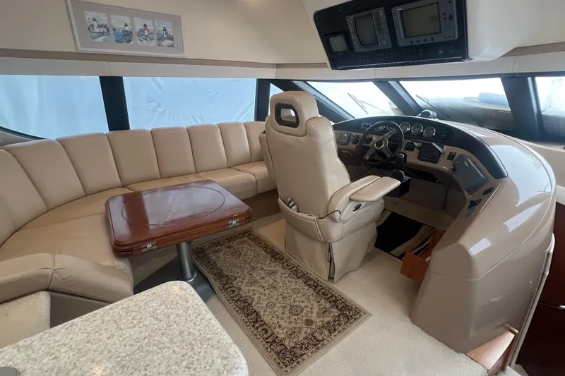 Betty Jean Yacht Photos Pics Luxurious interior of 2000 Carver 530 Voyager Pilothouse with plush seating and helm.