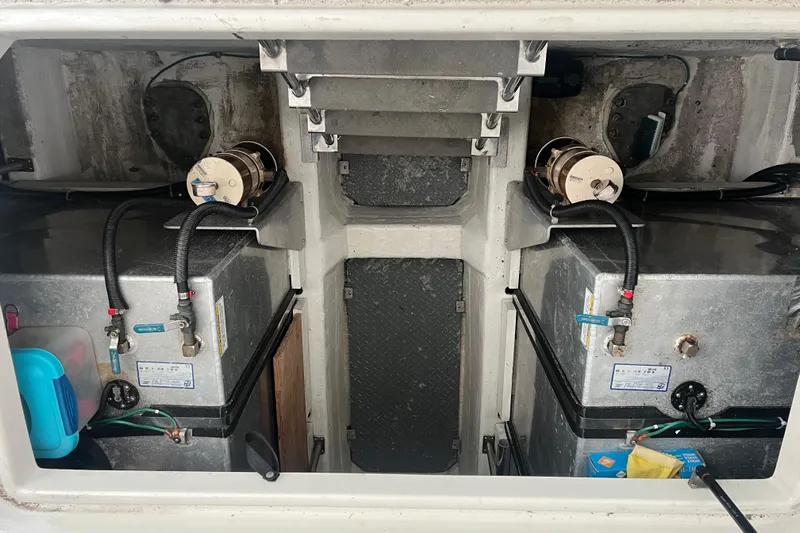 Betty Jean Yacht Photos Pics Engine compartment of a 2000 Carver 530 Voyager Pilothouse, showing fuel tanks and equipment.