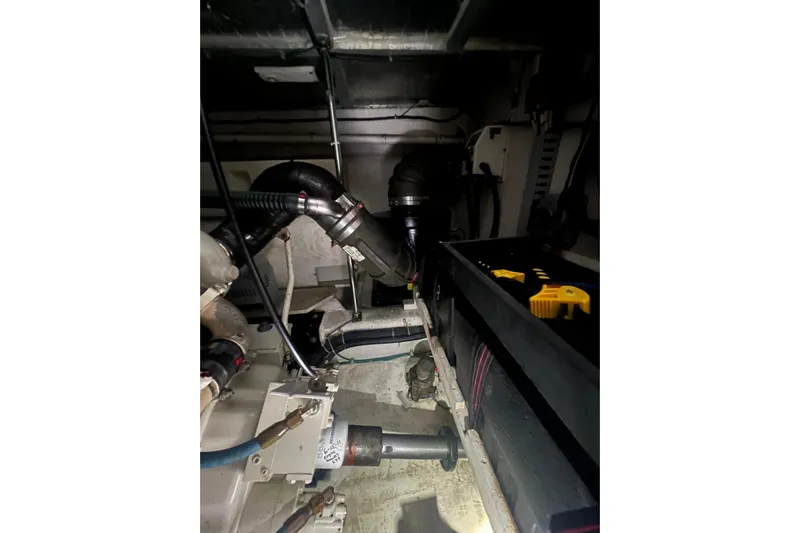 Betty Jean Yacht Photos Pics Engine room of 2000 Carver 530 Voyager Pilothouse, showcasing mechanical components and wiring.