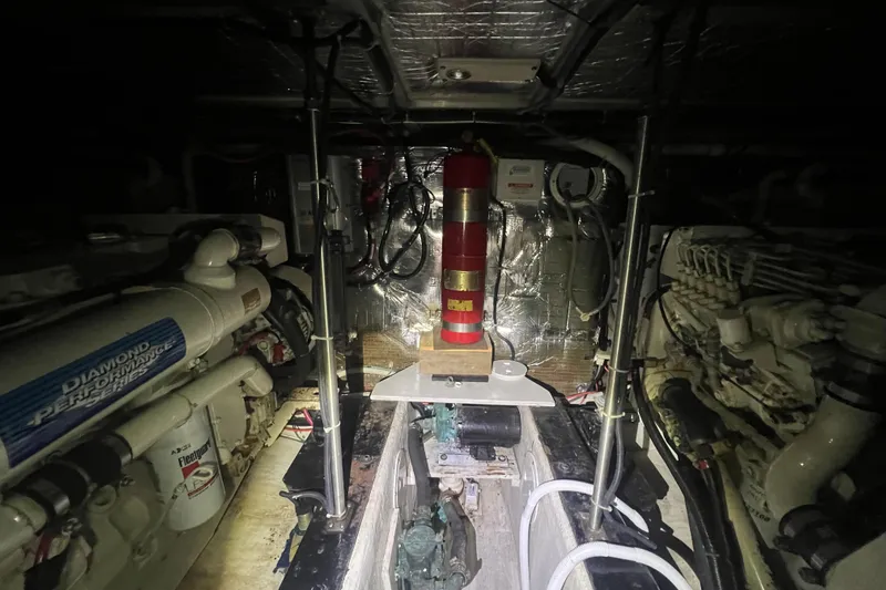 Betty Jean Yacht Photos Pics Engine room of 2000 Carver 530 Voyager Pilothouse with machinery and fire extinguisher.